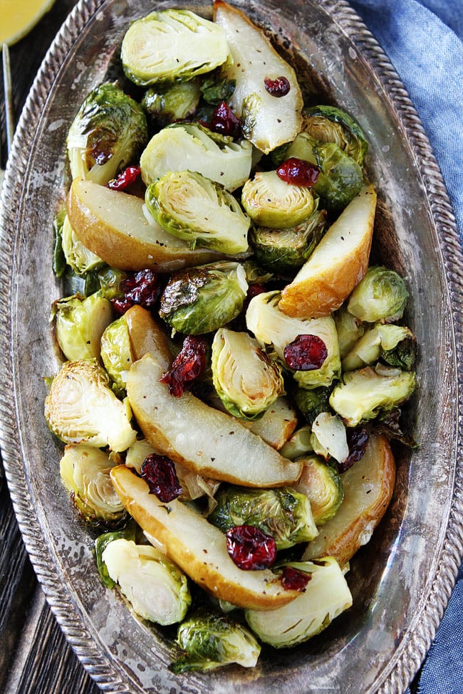 Roasted Pear and Cranberry Brussels Sprouts Recipe on twopeasandtheirpod.com Crispy Brussels sprouts with sweet roasted pears, dried cranberries, lemon, and honey. This simple side dish goes great with any meal. Roasted Pear and Cranberry Brussels Sprouts Recipe