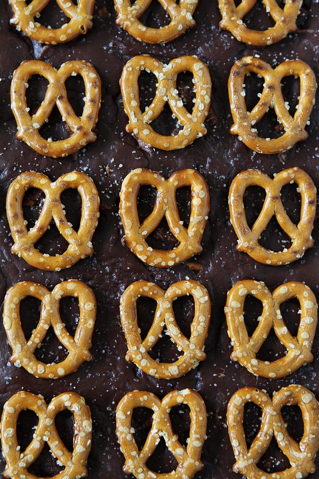 Salted Caramel Pretzel Fudge Recipe on twopeasandtheirpod.com This decadent sweet and salty fudge is made in the microwave and only takes a few minutes to make. It makes a great holiday gift! Salted Caramel Pretzel Fudge Recipe