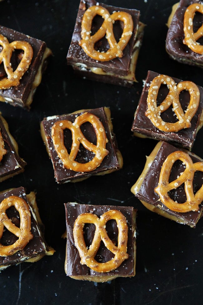 Salted Caramel Pretzel Fudge Recipe on twopeasandtheirpod.com This decadent fudge is made in the microwave and only takes a few minutes to make, but no one will ever know because it is so amazing! Salted Caramel Pretzel Fudge Recipe