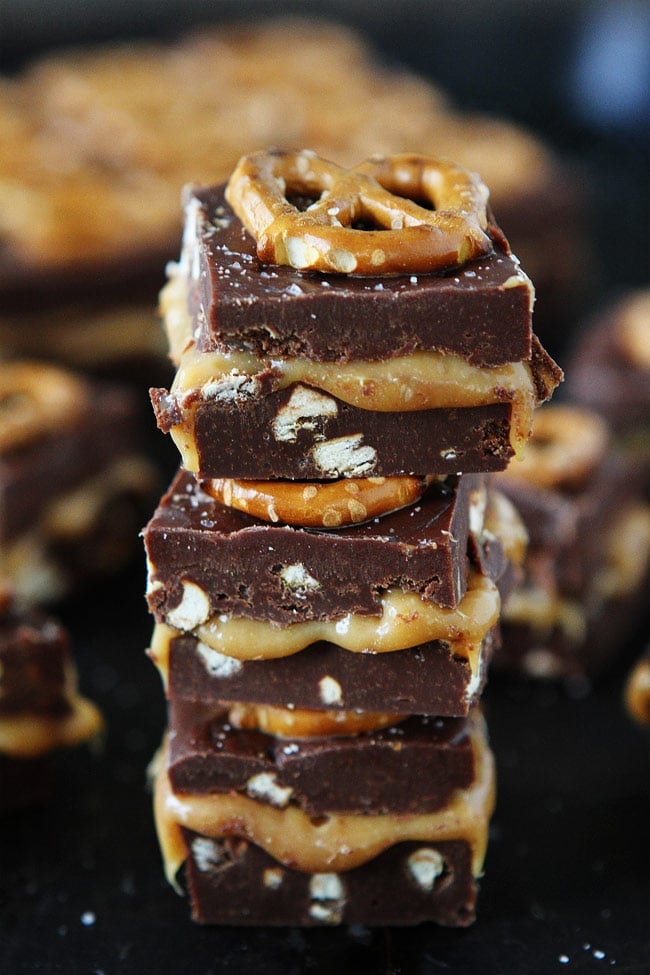 Salted Caramel Pretzel Fudge Recipe on twopeasandtheirpod.com This decadent fudge is made in the microwave and only takes a few minutes to make, but no one will ever know because it is so amazing! Salted Caramel Pretzel Fudge Recipe