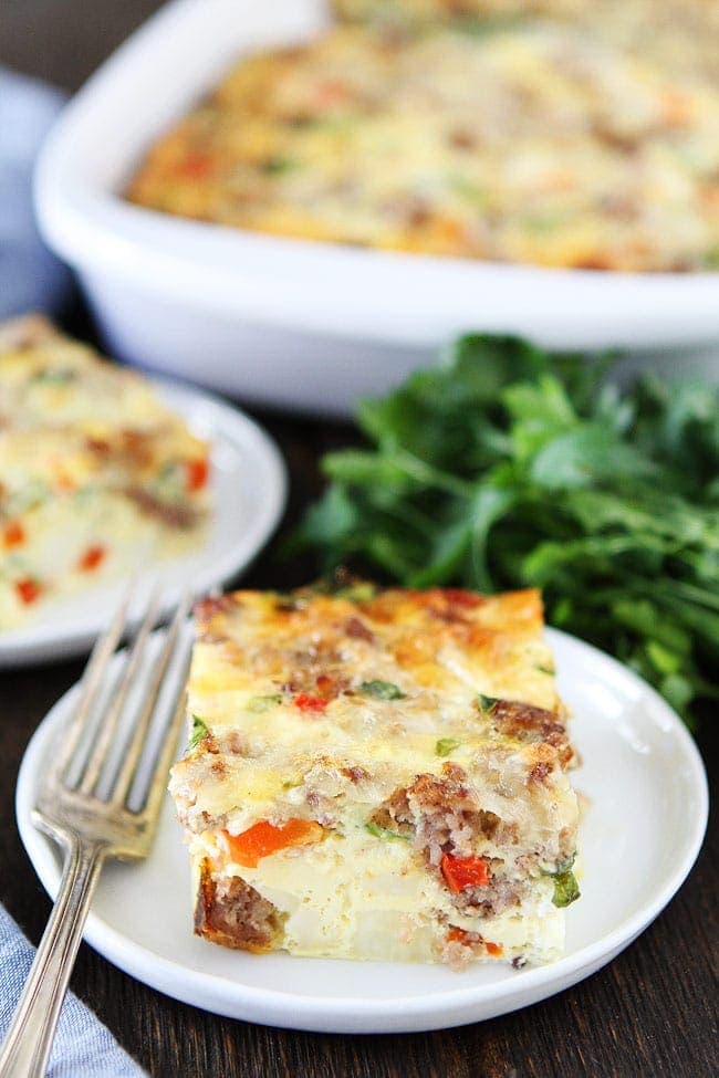 Sausage, Cheese, and Potato Egg Casserole Recipe on twopeasandtheirpod.com This easy breakfast casserole feeds a crowd and can be made in advance. It is perfect for holidays and get togethers. Sausage, Cheese, and Potato Egg Casserole Recipe