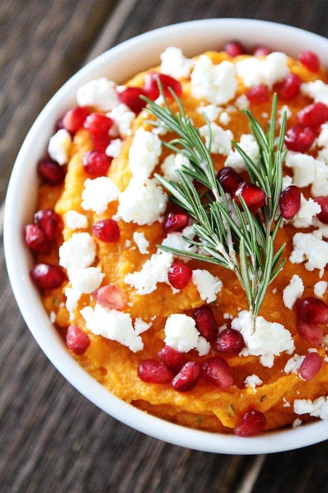 Sweet Potato Hummus Recipe on twopeasandtheirpod.com Simple sweet potato hummus with roasted garlic, rosemary, feta cheese, and pomegranate. This is the perfect holiday appetizer! Sweet Potato Hummus Recipe
