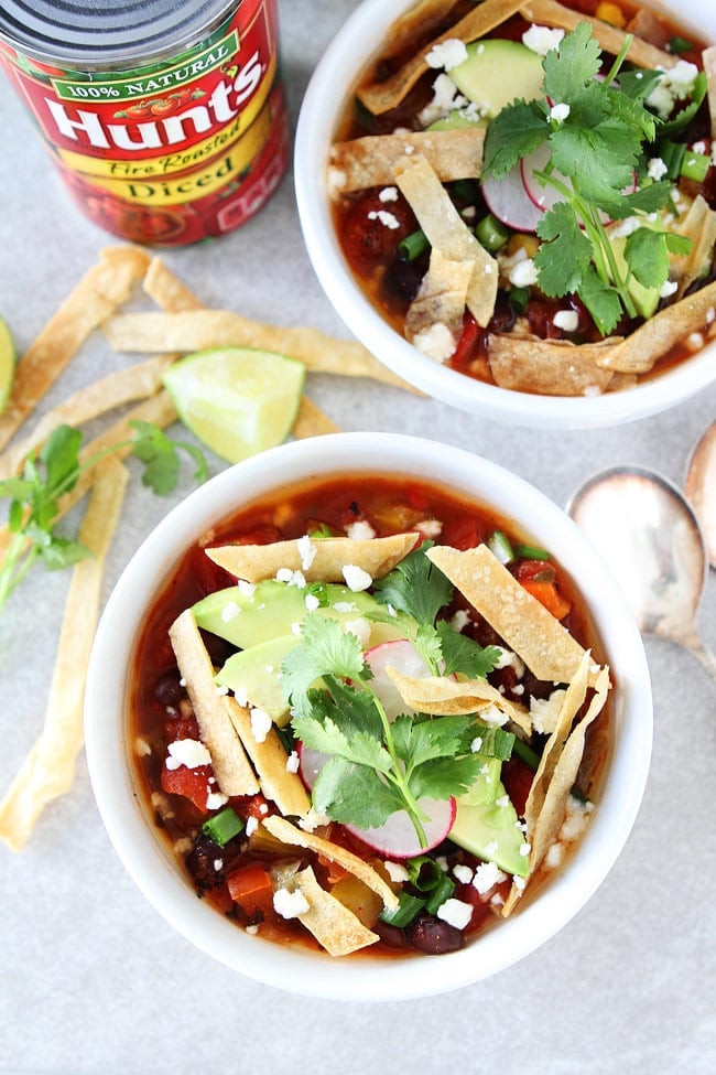 Slow Cooker Black Bean Tortilla Soup Recipe on twopeasandtheirpod.com This easy vegetarian tortilla soup is a family favorite. It is made in the crockpot and is great for lunch or dinner. Slow Cooker Black Bean Tortilla Soup Recipe