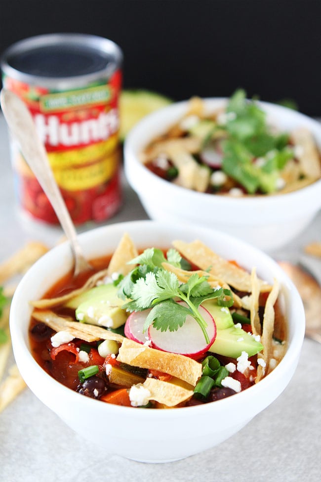 Slow Cooker Black Bean Tortilla Soup Recipe on twopeasandtheirpod.com This easy vegetarian tortilla soup is a family favorite. It is made in the crockpot and is great for lunch or dinner. Slow Cooker Black Bean Tortilla Soup Recipe