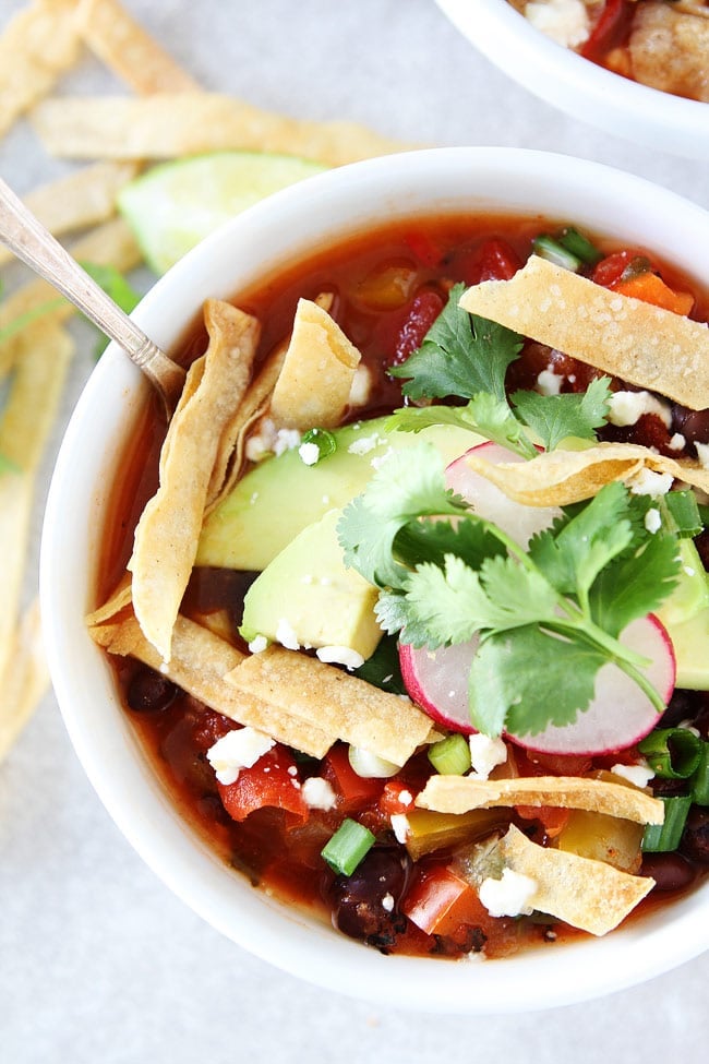 Slow Cooker Black Bean Tortilla Soup Recipe on twopeasandtheirpod.com This easy vegetarian tortilla soup is a family favorite. It is made in the crockpot and is great for lunch or dinner. Slow Cooker Black Bean Tortilla Soup Recipe