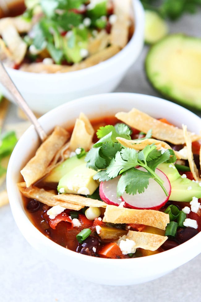 Slow Cooker Black Bean Tortilla Soup Recipe on twopeasandtheirpod.com This easy vegetarian tortilla soup is a family favorite. It is made in the crockpot and is great for lunch or dinner. Slow Cooker Black Bean Tortilla Soup Recipe