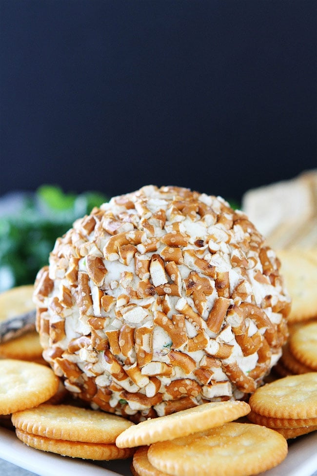 Bacon Cheddar Pretzel Cheese Ball Recipe on twopeasandtheirpod.com This easy cheese ball is the perfect party appetizer. It can be made in advance and is great served with crackers. Bacon Cheddar Pretzel Cheese Ball Recipe