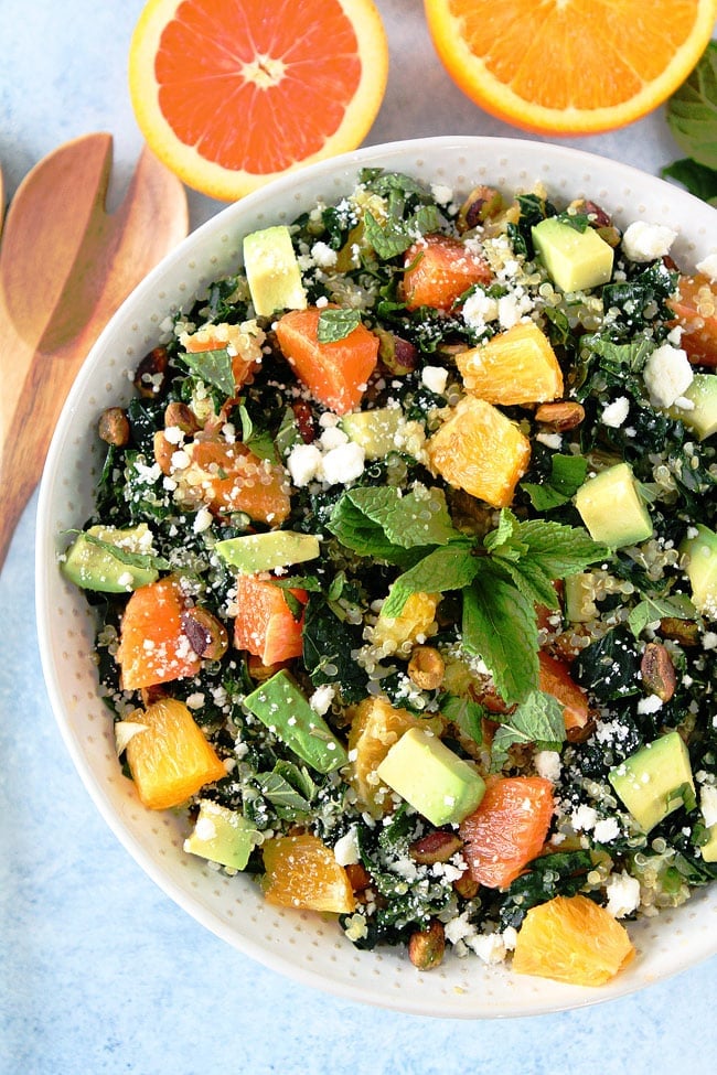 Orange, Avocado, and Kale Quinoa Salad Recipe on twopeasandtheirpod.com Kale salad with quinoa, orange, avocado, pistachios, feta cheese, mint, and a simple citrus dressing. You will love this refreshing salad. Orange, Avocado, and Kale Quinoa Salad Recipe
