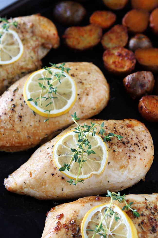 Sheet Pan Lemon Thyme Chicken with Smoked Paprika Potatoes Recipe on twopeasandtheiropd.com This easy and delicious chicken dinner is made on ONE pan! It is a great weeknight meal. Sheet Pan Lemon Thyme Chicken with Smoked Paprika Potatoes Recipe