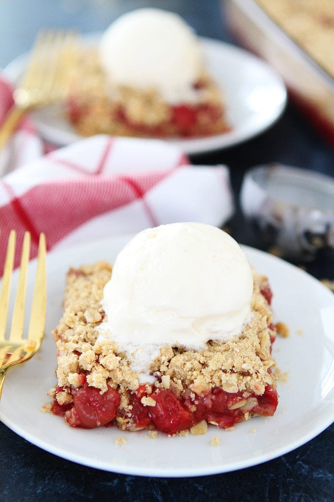 Cherry Oatmeal Bars Recipe on twopeasandtheirpod.com Tart cherries are spread between buttery oatmeal layers to create a delicious dessert. If you like cherry pie, you will LOVE these easy bars. Cherry Oatmeal Bars