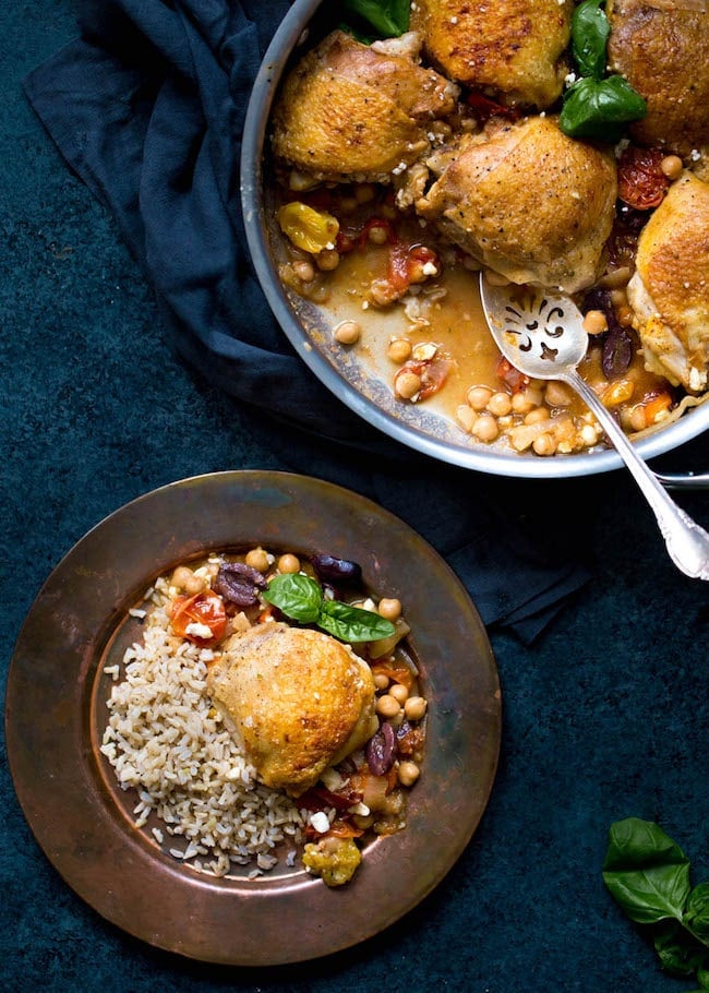 Skillet Chicken with Chickpeas, Tomatoes, and Olives Recipe on twopeasandtheirpod.com This easy one skillet chicken dinner is made with chickpeas, tomatoes, kalamata olives, feta cheese, and fresh basil. It is full of flavor and a family favorite! Skillet Chicken with Chickpeas, Tomatoes, and Olives Recipe