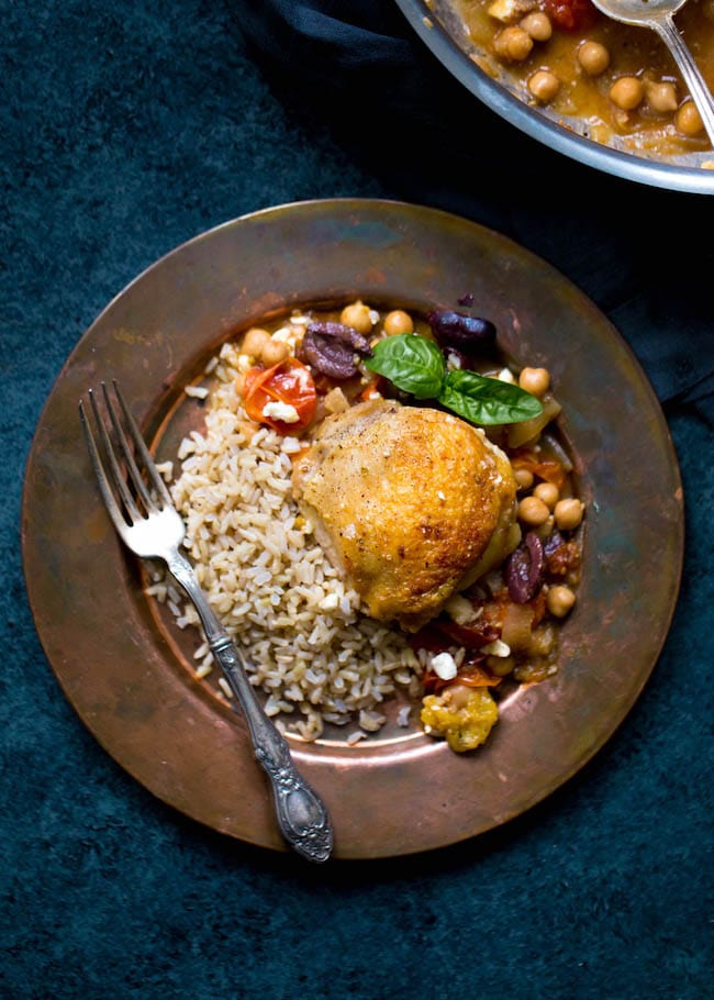 Skillet Chicken with Chickpeas, Tomatoes, and Olives Recipe on twopeasandtheirpod.com This easy one skillet chicken dinner is made with chickpeas, tomatoes, kalamata olives, feta cheese, and fresh basil. It is full of flavor and a great weeknight meal. Skillet Chicken with Chickpeas, Tomatoes, and Olives Recipe