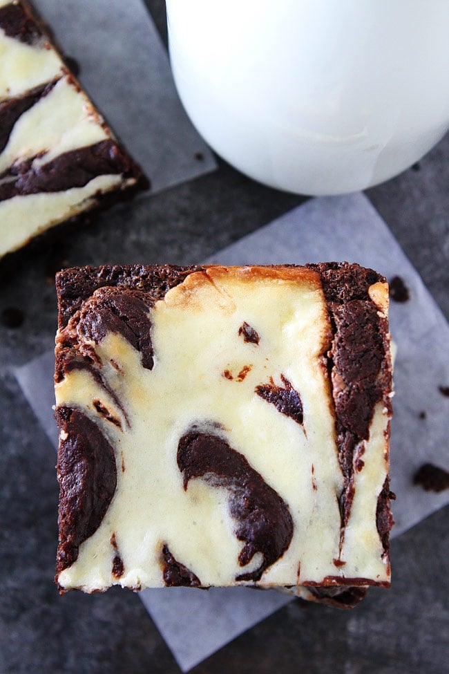 These fudgy Cheesecake Truffle Brownies have a layer of chocolate truffles and a smooth cheesecake swirl. They are the BEST brownies ever! Cheesecake Truffle Brownies cut brownies
