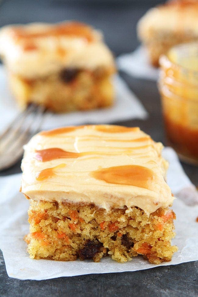 Easy Carrot Cake with Caramel Cream Cheese Frosting Recipe on twopeasandtheirpod.com This moist carrot cake is packed with carrots, pineapple, cinnamon, raisins and topped with a thick layer of caramel cream cheese frosting. It is the perfect Easter dessert! Easy Carrot Cake with Caramel Cream Cheese Frosting Recipe