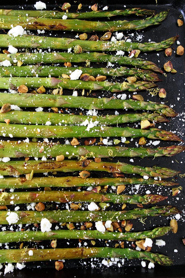 Roasted Asparagus with Lemon, Feta, and Pistachios Recipe on twopeasandtheirpod.com Easy oven-roasted asparagus with lemon, feta cheese, and pistachios. This simple spring side dish goes great with any meal. Roasted Asparagus with Lemon, Feta, and Pistachios