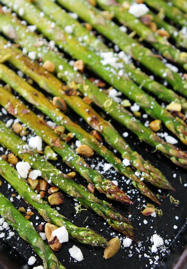 Roasted Asparagus with Lemon, Feta, and Pistachios Recipe on twopeasandtheirpod.com Easy oven-roasted asparagus with lemon, feta cheese, and pistachios. This easy spring side dish is perfect for Easter or any day! Roasted Asparagus with Lemon, Feta, and Pistachios Recipe
