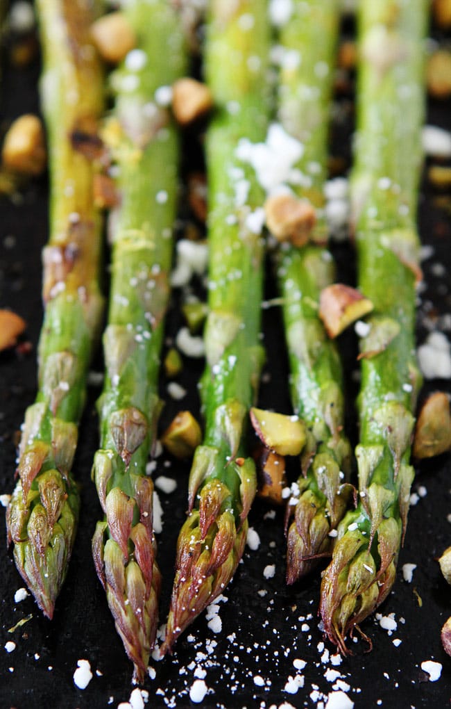 Roasted Asparagus with Lemon, Feta, and Pistachios Recipe on twopeasandtheirpod.com This easy oven-roasted asparagus with lemon, feta cheese, and pistachios is a MUST make for spring! Roasted Asparagus with Lemon, Feta, and Pistachios Recipe