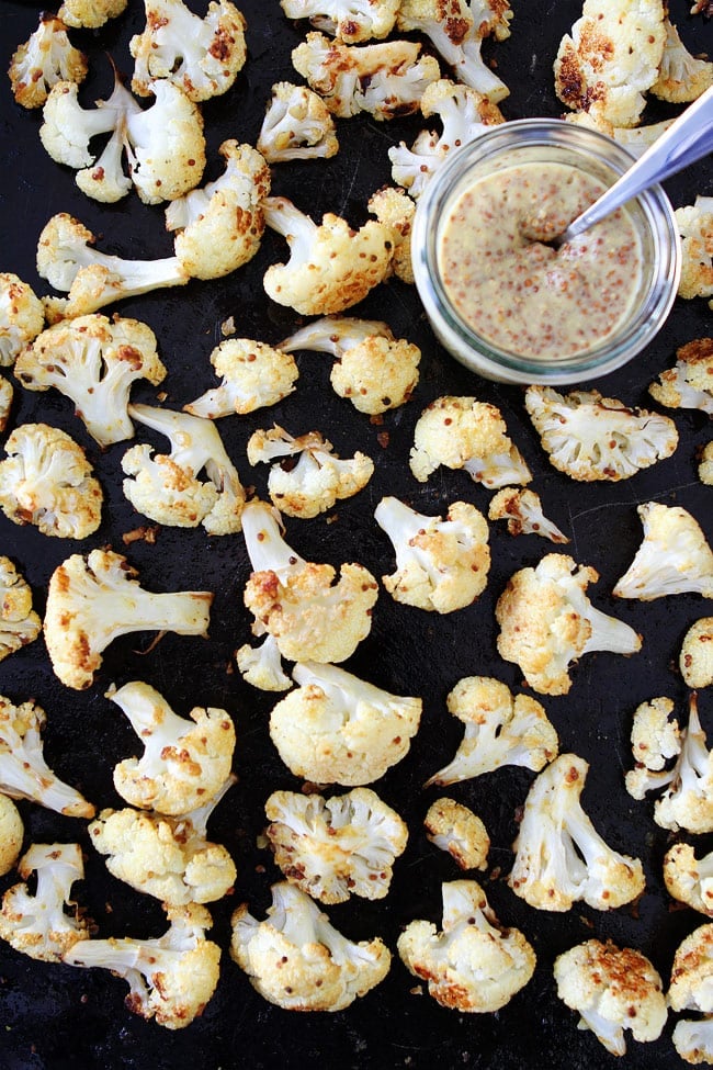Roasted Mustard Cauliflower Recipe on twopeasandtheirpod.com Cauliflower tossed in olive oil, mustard, garlic, and lemon and roasted until crispy and caramelized. This is the BEST roasted cauliflower recipe! Roasted Mustard Cauliflower Recipe