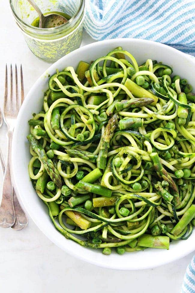 Zucchini Noodles with Asparagus, Peas, and Basil Vinaigrette Recipe on twopeasandtheirpod.com This vibrant green zucchini noodle dish is perfect for spring. It is light, refreshing, and super simple to make. Zucchini Noodles with Asparagus, Peas, and Basil Vinaigrette Recipe