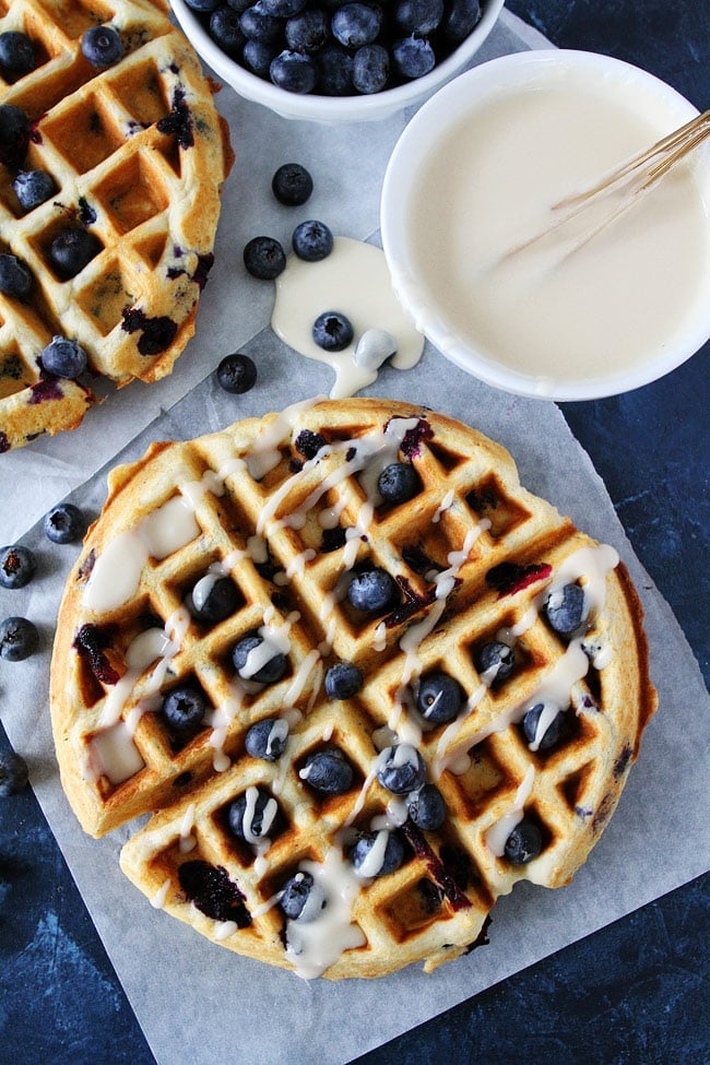 These light and fluffy Blueberry Sour Cream Waffles with a sweet maple glaze will make any morning better! Blueberry Sour Cream Waffles with maple glaze