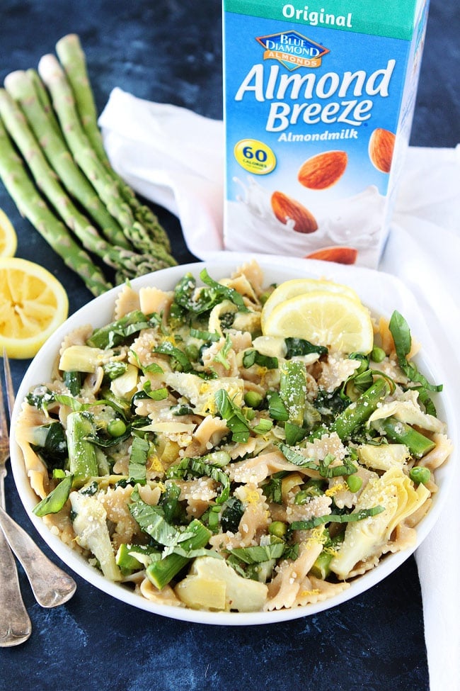 Creamy Lemon Spring Vegetable Pasta Recipe on twopeasandtheirpod.com This light and creamy lemon pasta with asparagus, artichokes, peas, and basil makes a great spring meal. Creamy Lemon Spring Vegetable Pasta Recipe