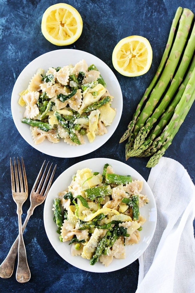 Creamy Lemon Spring Vegetable Pasta Recipe on twopeasandtheirpod.com This light and creamy lemon pasta with asparagus, artichokes, peas, and basil makes a great spring meal. Creamy Lemon Spring Vegetable Pasta Recipe