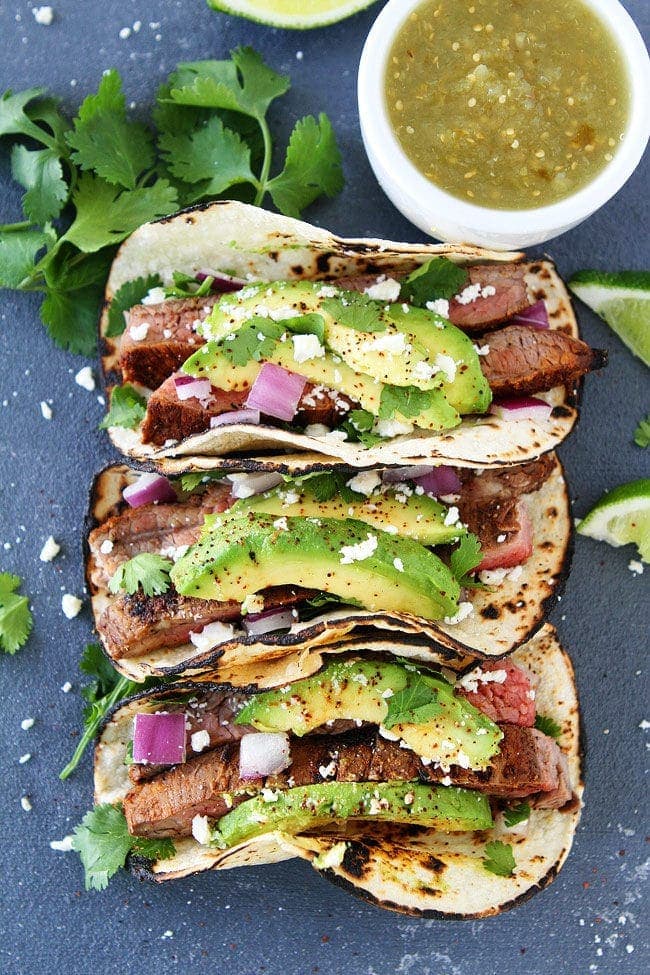 Grilled Steak Tacos in tortillas with avocado.