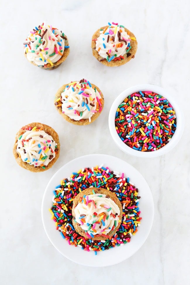 Sprinkle Chocolate Chip Cookie Cups topped with frosting are a fun and delicious dessert for parties, potlucks, or just because!