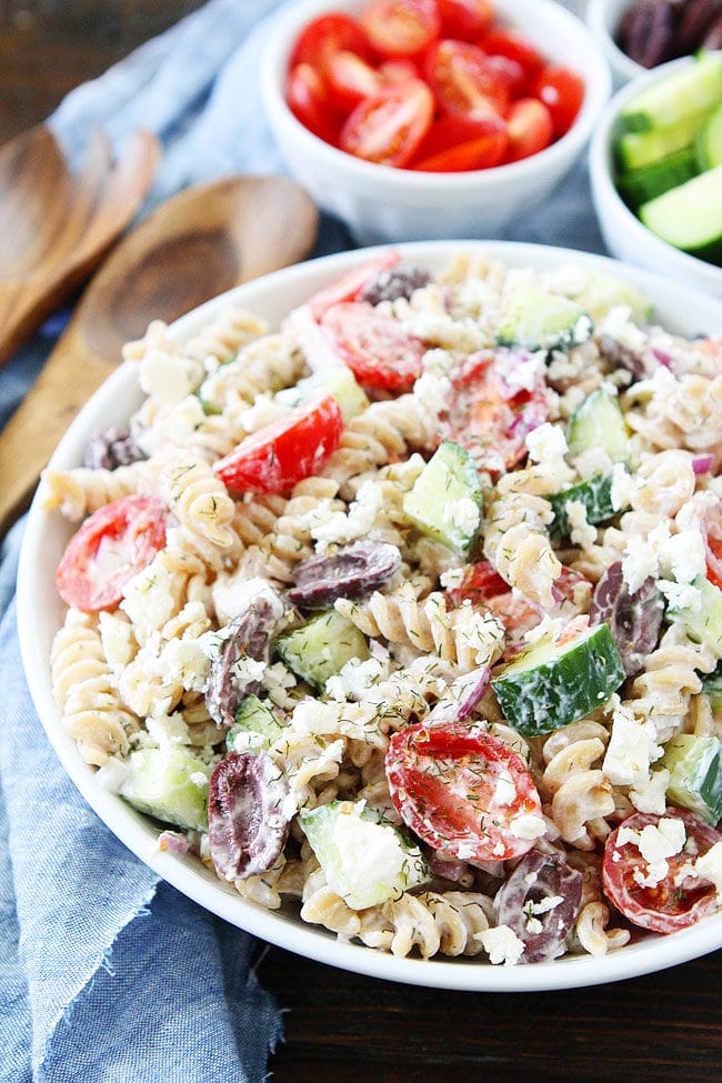 Creamy Greek Pasta Salad is a great cold pasta salad for barbecues and potlucks Greek Pasta Salad with Feta Cheese, Cucumber, Olive, Tomato, and Onion