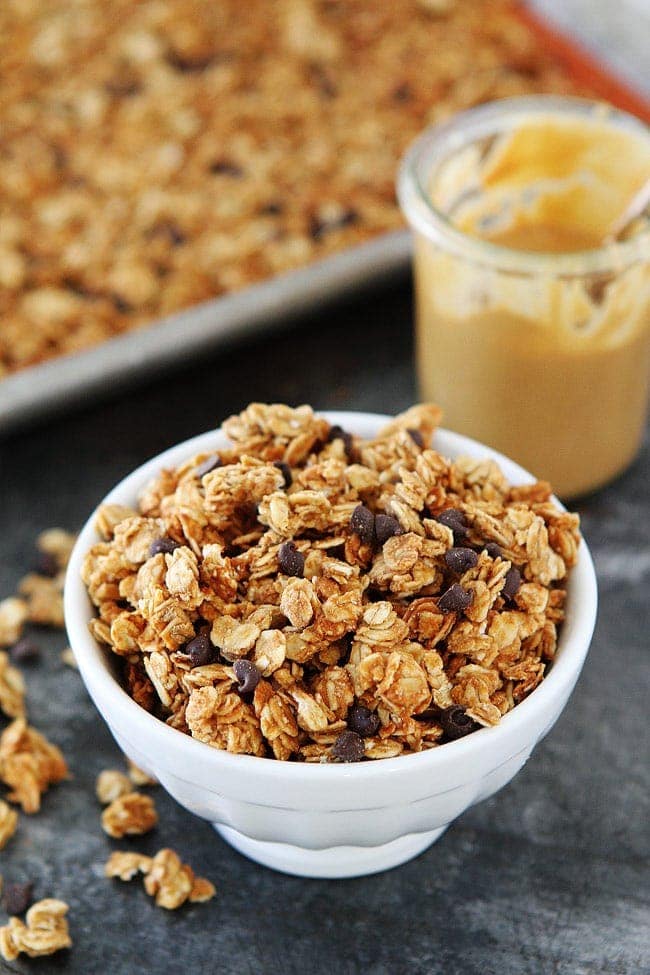 Easy Peanut Butter Granola with mini chocolate chips makes a great breakfast or snack! You only need 4 ingredients! #peanutbutter #granola #oats #breakfast #homemadegranola Peanut Butter Granola Recipe