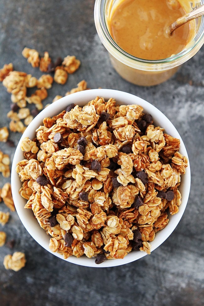 4-Ingredient Homemade Granola is a family favorite for breakfast or for snacking! #granola #peanutbutter #homemadegranola #chocolate Peanut Butter Granola Recipe served in bowl