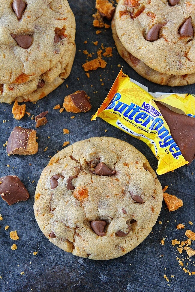 Peanut Butter Butterfinger Cookies-soft peanut butter cookies with Butterfinger candy bars and milk chocolate chips! Use your leftover Halloween candy to make these delicious cookies!