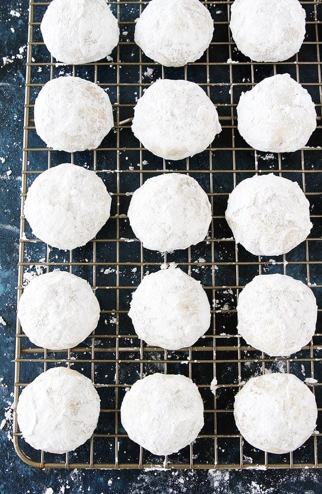 Mexican wedding cookies on cooling rack.