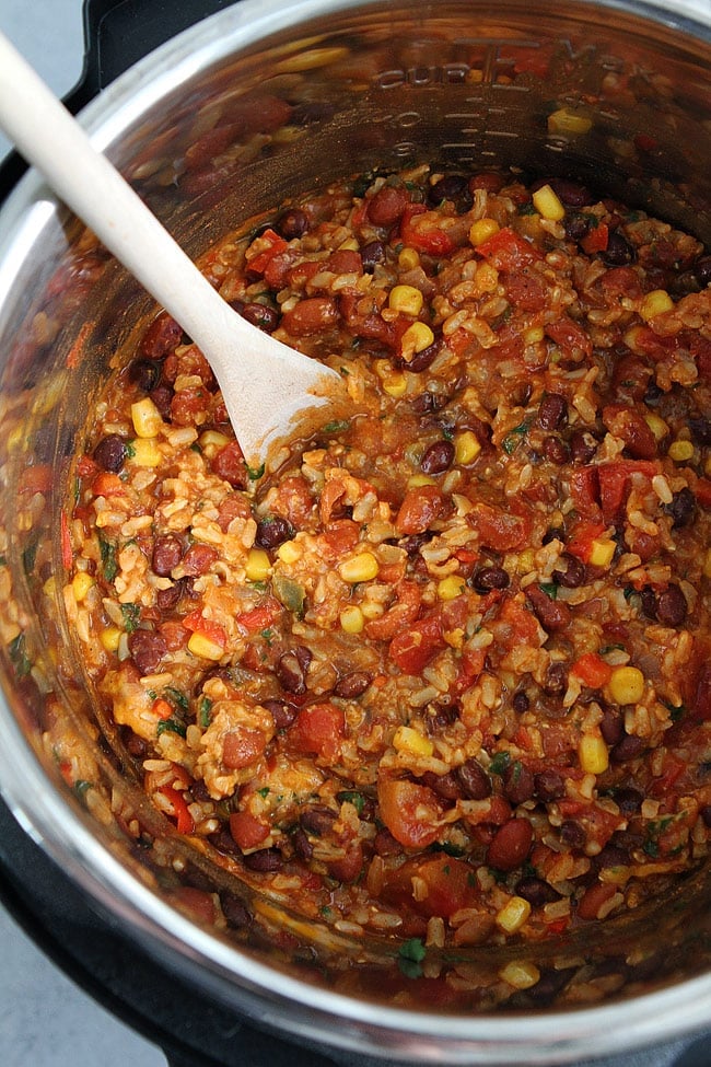 Easy Mexican Rice Casserole is a family favorite dinner and is perfect for busy weeknights because it is made in the Instant Pot. You will love this one pot meatless meal! #InstantPot #vegetarian #dinner #easydinner #easyrecipe #glutenfree Instant Pot Mexican Rice Casserole