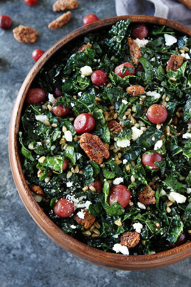 This easy kale salad with roasted grapes and farro goes great with any meal or can be a meal! You will love the flavors! #salad #vegetarian #farro #kale #kalesalad
