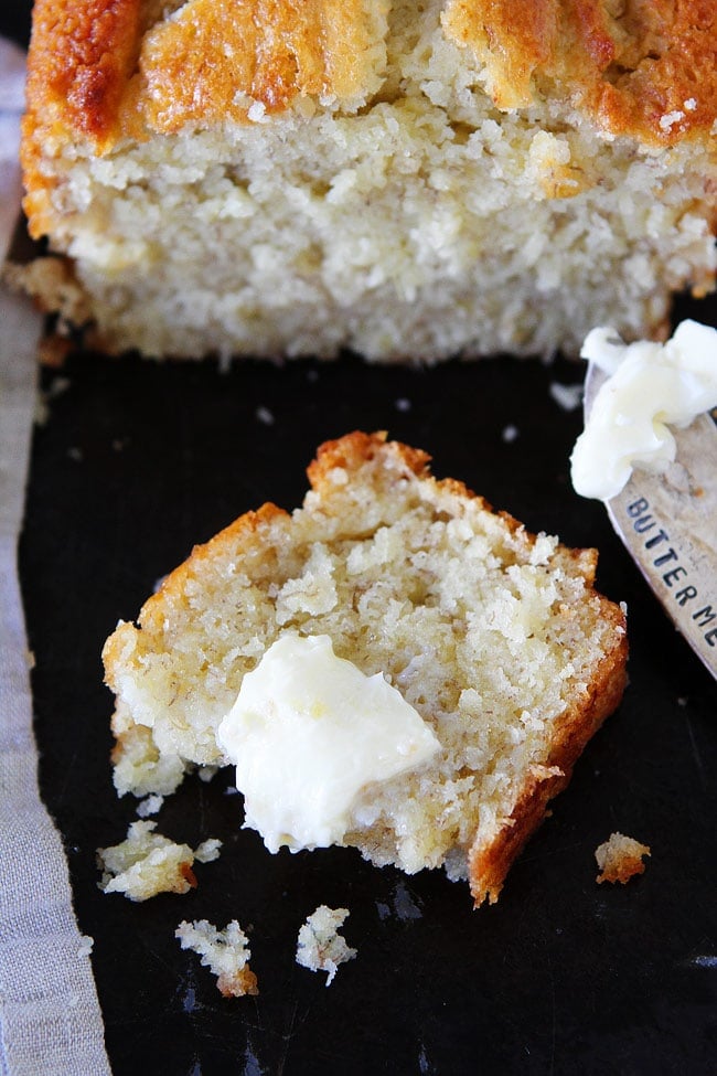 Buttermilk Banana Bread is the BEST banana bread recipe! Use your brown bananas to make this family favorite recipe! #bananas #bananabread #buttermilk #bread #quickbread Buttermilk Banana Bread slice with butter.