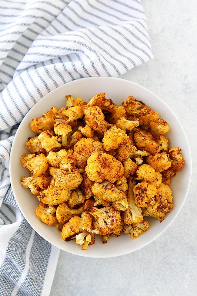 Turmeric Roasted Cauliflower is easy to make and goes great with any meal! You will love this easy and healthy recipe! #healthyrecipe #easyrecipe #cauliflower #vegan #glutenfree #vegetarian How to Make Roasted Cauliflower