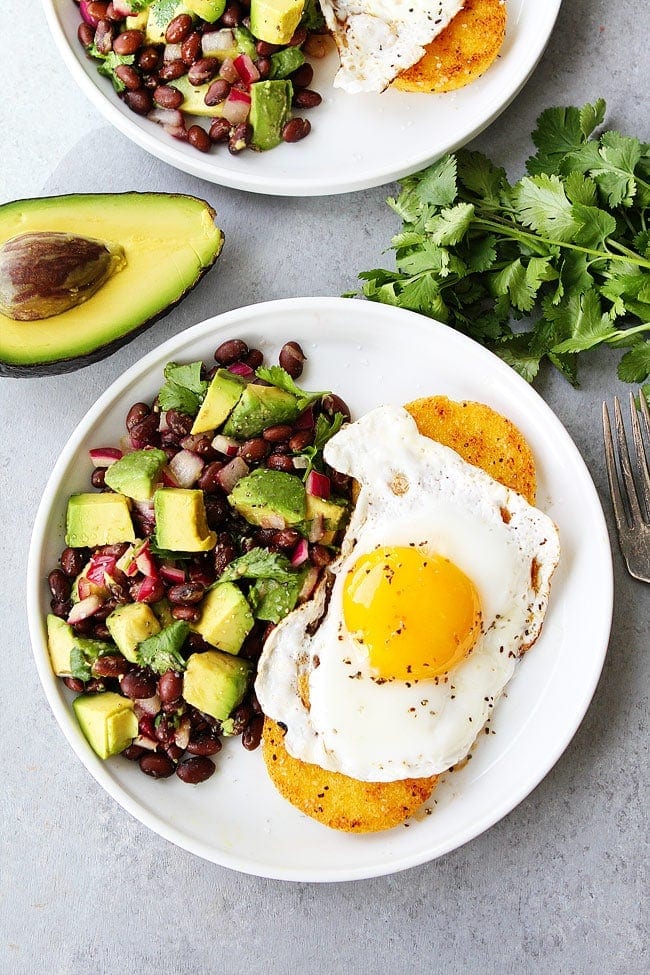 Polenta Rounds With Fried Eggs And Avocado Bean Salsa Is The Perfect Quick And Easy Meal. You Can Enjoy This Healthy And Satisfying Recipe For Breakfast, Lunch Or Dinner! #vegetarian #glutenfree #vegetarianrecipes #easyrecipe #healthyrecipe #healthyeating #eggs #beans #avocado Polenta Rounds with Eggs and Avocado Bean Salsa Recipe