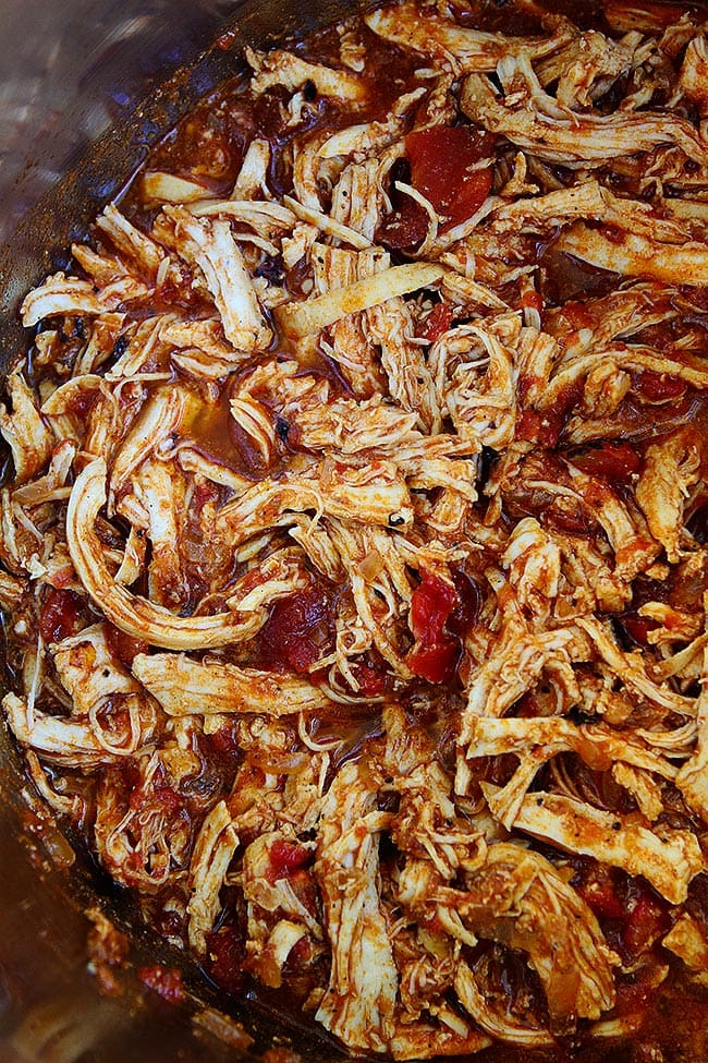 Instant Pot Chicken Tacos Make A Great Weeknight Meal. They Are Easy To Make And A Family Favorite! Load These Easy Shredded Chicken Tacos Up With All Of Your Favorite Mexican Toppings And Dinner Is Done! #chicken #tacos #chickentacos #InstantPot #easyrecipe #dinner #easydinner #tacotuesday #kidfriendly Instant Pot Chicken Tacos