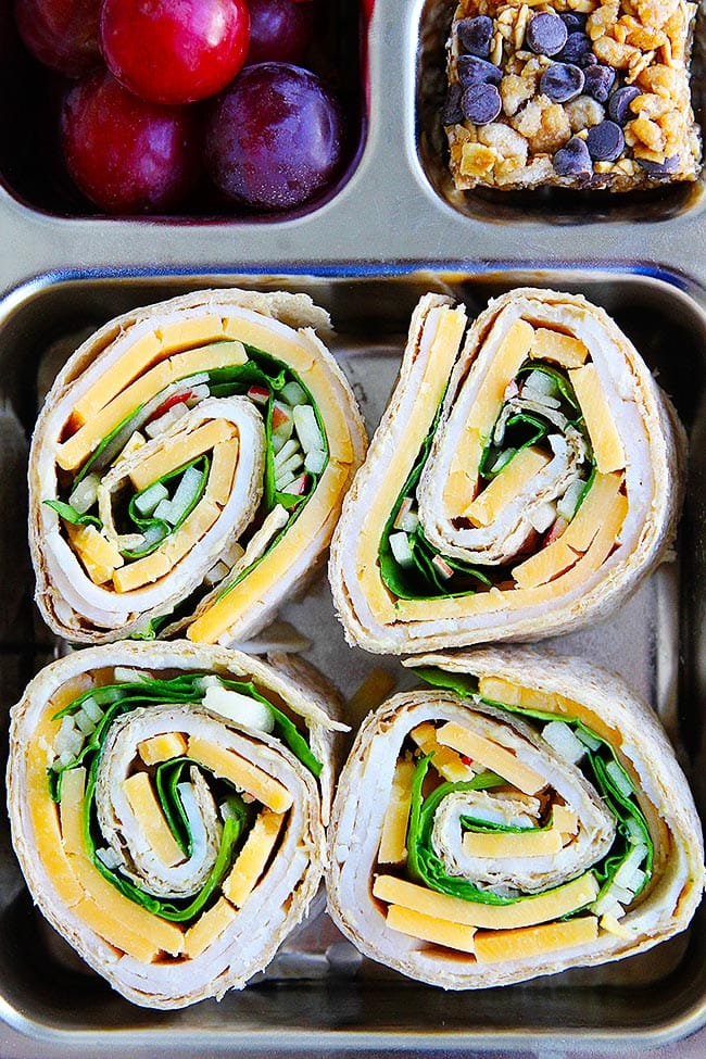 Turkey Cheddar Apple Pinwheels-Turkey, Cheddar Cheese, Spinach, Apple, And Mustard Get Rolled Up In Whole Wheat Tortillas And Cut Into Bite Size? Pinwheels. These Easy Turkey Pinwheels Make A Fun And Delicious Lunch, Snack, Or Party Appetizer. #turkey #pinwheels #backtoschool #lunchbox #lunchboxideas #tortilla #cheese #kidfriendly #easyrecipe #schoollunch Easy Turkey Pinwheels