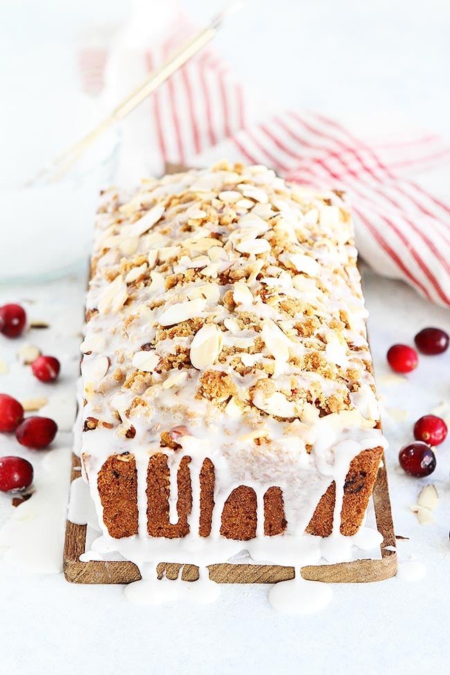 Cranberry Almond Bread-This Easy Quick Bread Is Dotted With Tart Cranberries And Topped With A Sweet Almond Streusel Topping. It Is The Perfect Cranberry Bread Recipe For The Holidays! #cranberry #Christmas #holidays #baking #bread #almond #streusel #recipe Cranberry Bread with almonds streusel and glaze