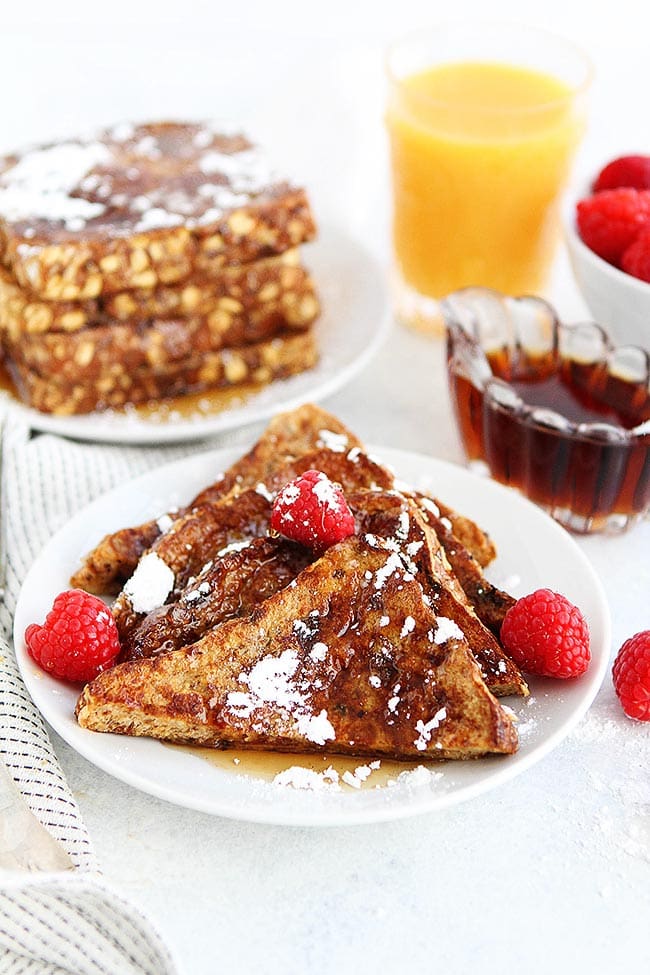 Cinnamon Raisin French Toast-You Will Love This Delicious Twist On The Classic French Toast Recipe! The Cinnamon Raisin Bread Makes This French Toast Extra Special! #Frenchtoast #breakfast #brunch #recipe #bread Easy Cinnamon Raisin French Toast with berries