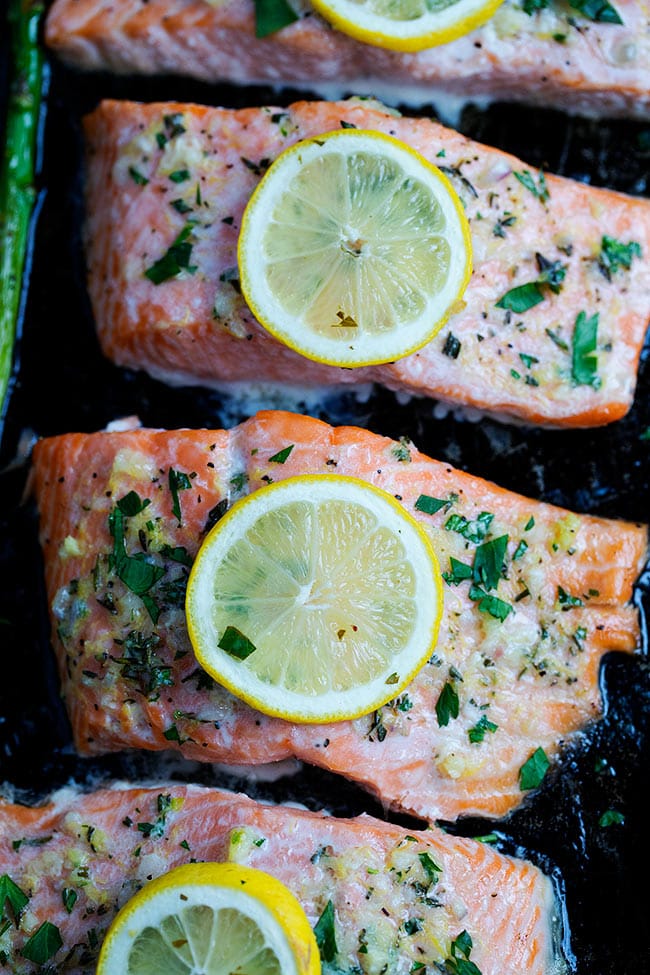 This Simple Sheet Pan Baked Salmon With Asparagus Recipe Is The Perfect Quick And Easy Dinner For Spring. It Takes Less Than 30 Minutes To Make! #salmon #sheetpan #easydinner #easyrecipe #glutenfree #asparagus #spring #Easter #lemon #fish #salmonrecipe Easy Baked Salmon Recipe