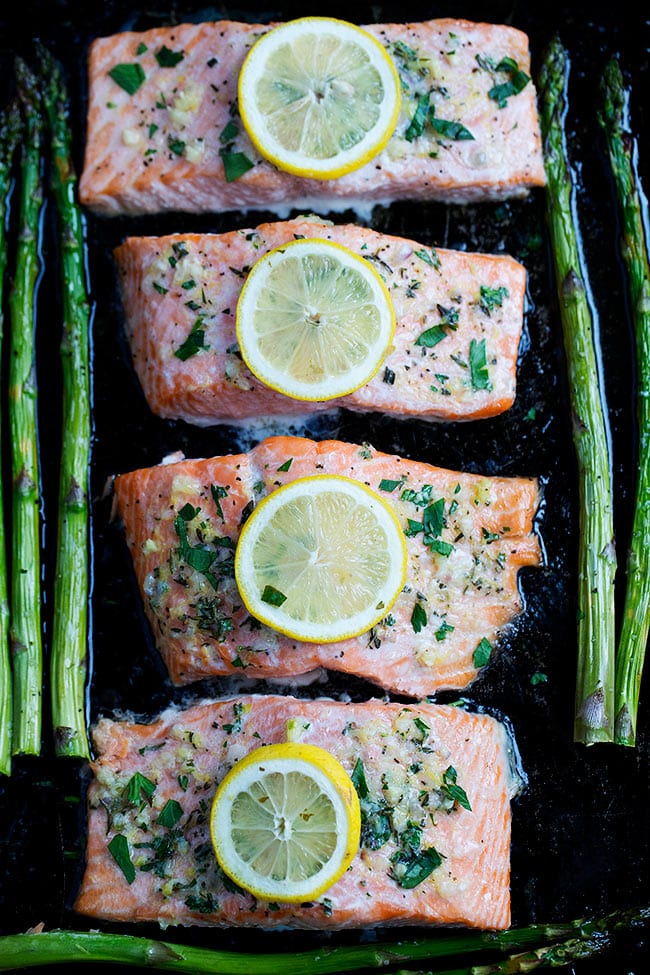 This Simple Sheet Pan Baked Salmon With Asparagus Recipe Is The Perfect Quick And Easy Dinner For Spring. It Takes Less Than 30 Minutes To Make! #salmon #sheetpan #easydinner #easyrecipe #glutenfree #asparagus #spring #Easter #lemon #fish #salmonrecipe Easy Sheet Pan Baked Salmon