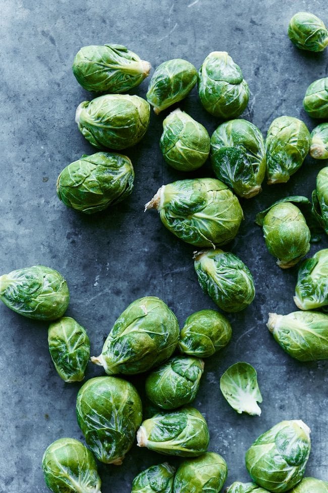 fresh brussels sprouts on cement background.