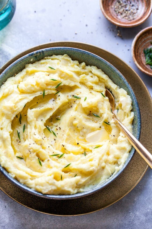 Garlic Mashed Potatoes in bowl with spoon. 