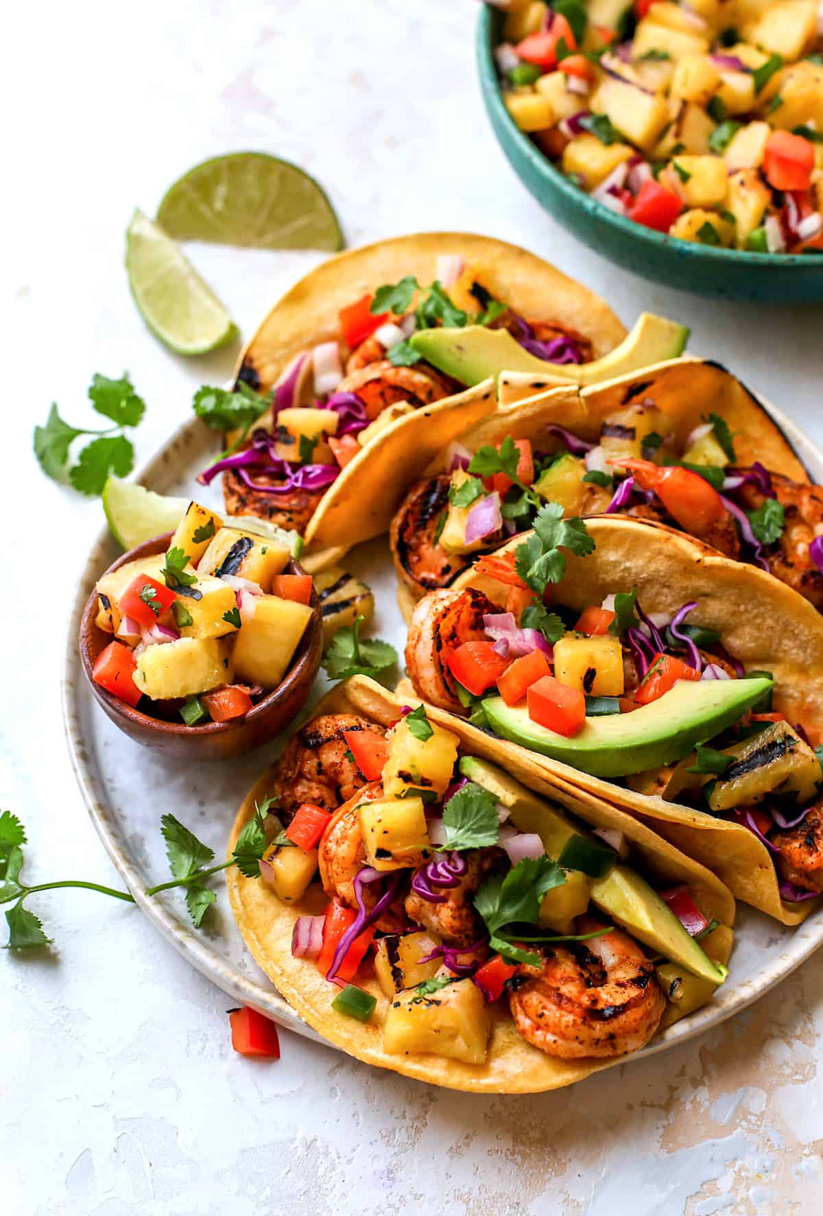 shrimp tacos with pineapple salsa and avocado.