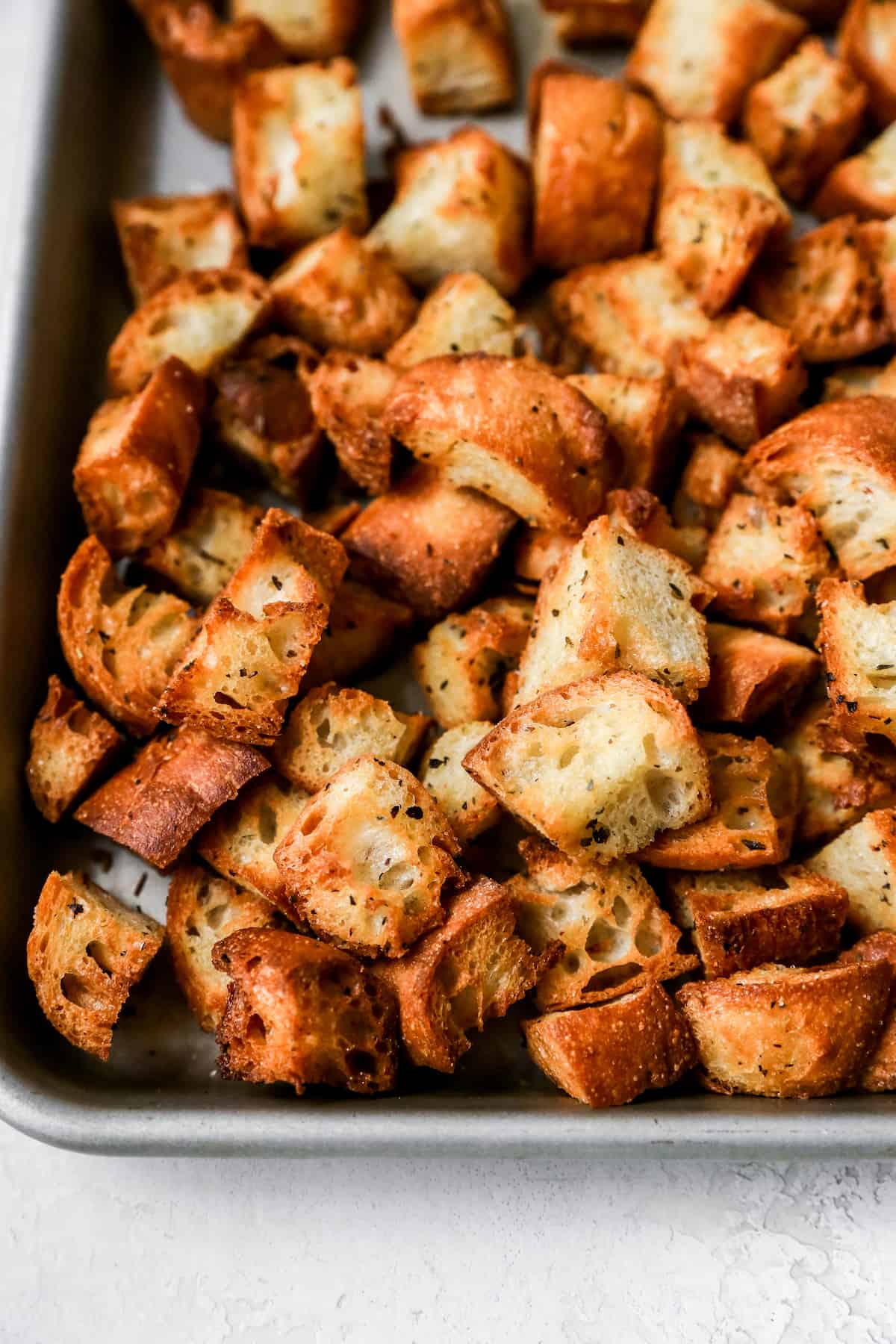 homemade croutons on sheet pan.