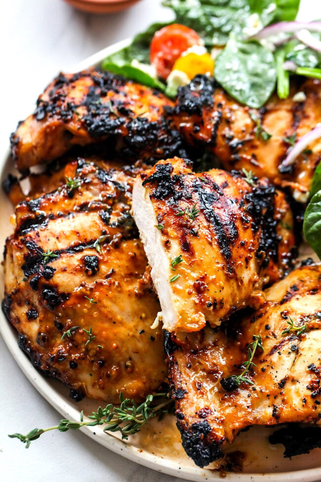 Honey Mustard Chicken on plate with a piece cut.