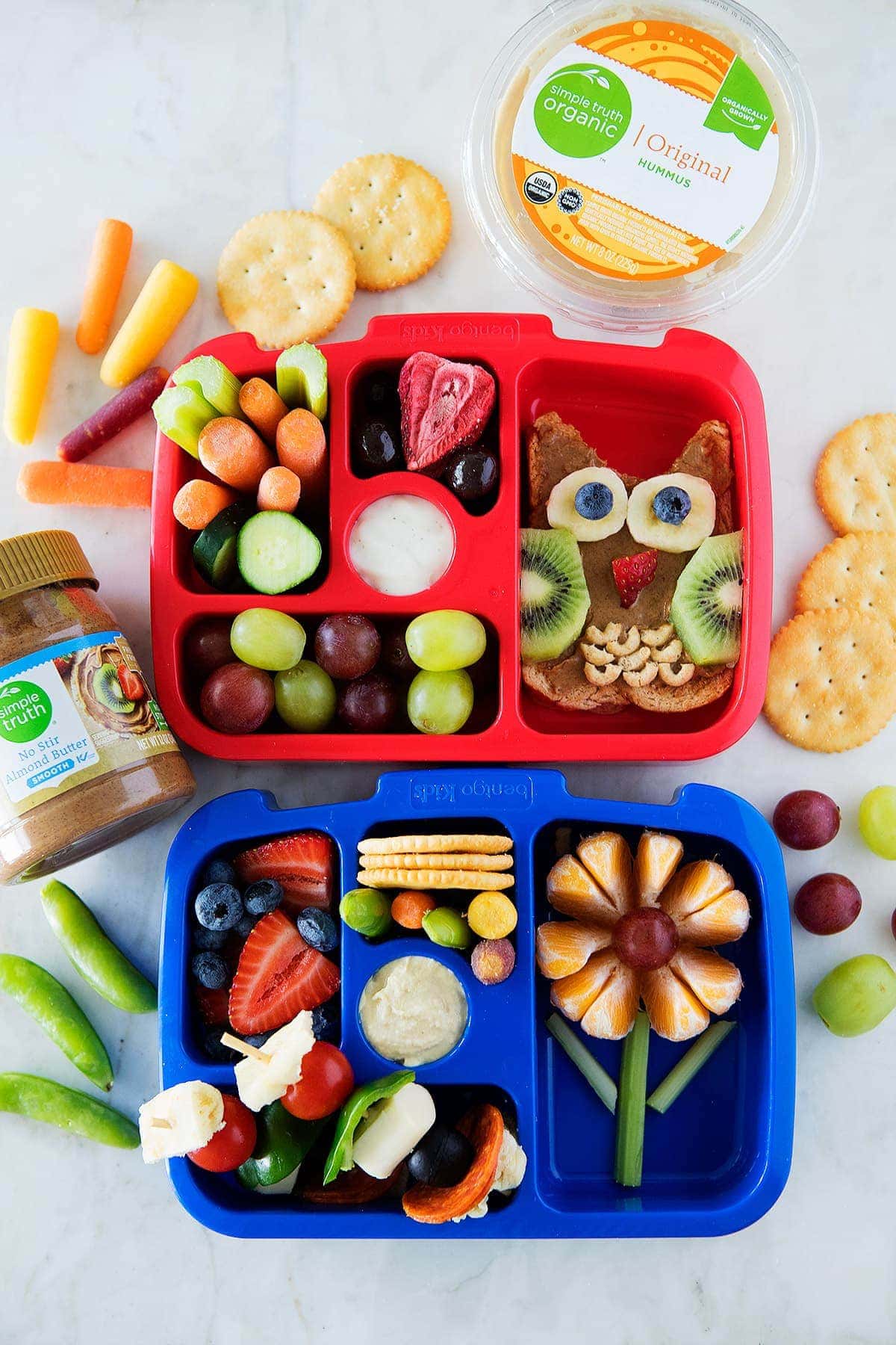 kids lunch box with fruits, veggies, and owl toast. 